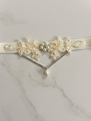 Ivory lace wedding garter with silver crystals and pearls with boho and vintage luxury vibe